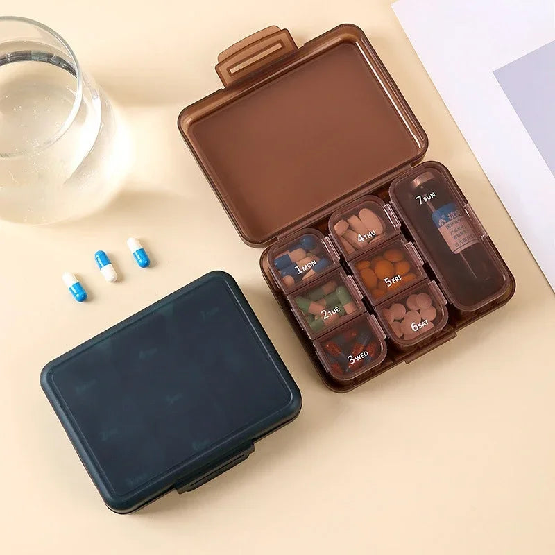 Portable 7-day pill box that can hold a bottle of oral solution
